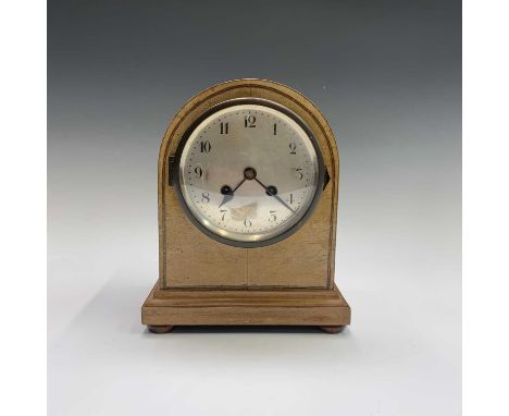 A German oak dome top mantel clock, striking on a gong, height 21cm.