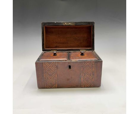 A Victorian mahogany dome top tea caddy, with twin bands of geometric inlaid decoration, internally with two lidded compartme