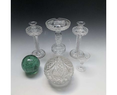 A Victorian green glass dump with internal bubble decoration, diameter 11cm, together with a pair of cut glass candlesticks w