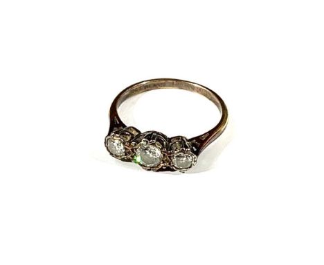 An 18ct gold three stone diamond ring