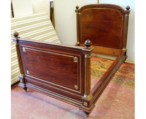 20th century French brass and mahogany bed, the arched ends with globe finials, 126cm high, 124cm wide and 205cm long.