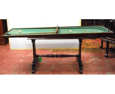 William IV mahogany bagatelle table, the interior with original baize, ivory balls and cue, on stretchered column supports, s