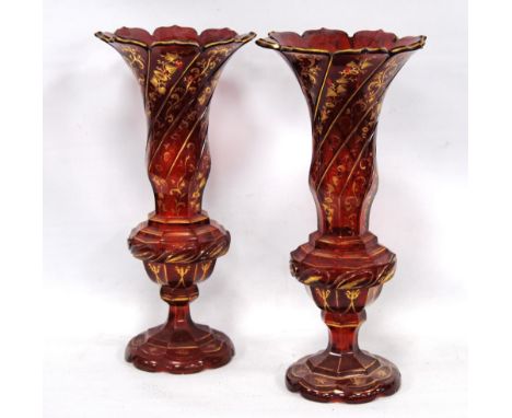 Pair of 19th century Bohemian gilt ruby glass vases of flared baluster form, 33.5cm high. Condition Report 1st vase: light we
