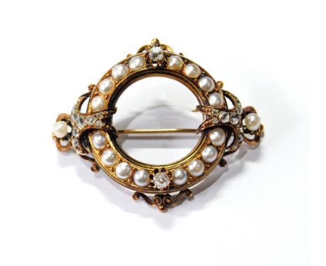 Victorian gold open circle brooch with pearls and diamond collets and scrolls, probably 18ct. Condition Report This is 52mm o