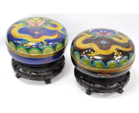 Pair of Chinese cloisonné bowls and covers decorated with dragons, 19cm, on hardwood stands. Condition Report The black bowl 