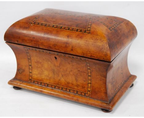 Victorian parquetry walnut tea caddy of domed, waisted form, fitted with two canisters, 19cm high and 28cm wide.