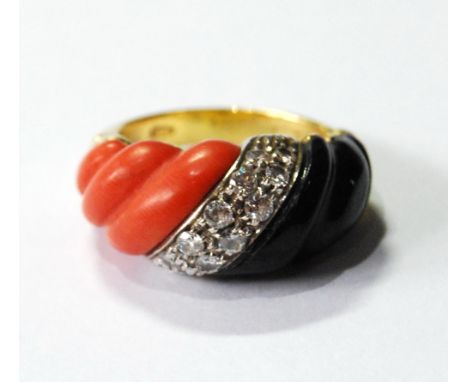 Dress ring with spiral of coral and onyx, with double band of diamonds between, in gold, '750'. Condition Report This is prob