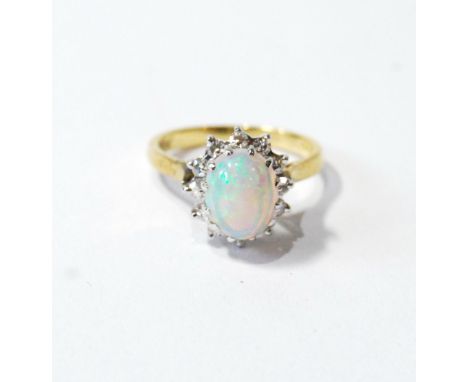 Cluster ring with an oval opal and mixed-cut diamond brilliants, in 18ct gold.