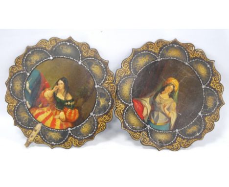 Pair of Victorian mother of pearl inlaid papier maché fan panels, lacking handles, 25cm diameter.