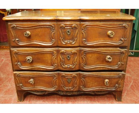 18th century continental commode of serpentine form with panelled sides, 92cm x 118cm.