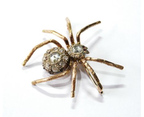 Brooch modelled as a spider with head and abdomen set with old brilliant and rose diamonds with ruby cabochon eyes. Condition