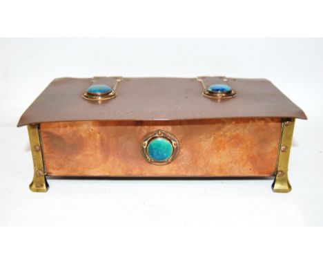 Arts and Crafts copper cigarette box, with turquoise enamel bosses, unmarked, 29cm. Condition Report Enamel cabochons are in 