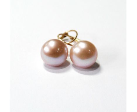 Pair of gold ear studs, each with a freshwater pearl.