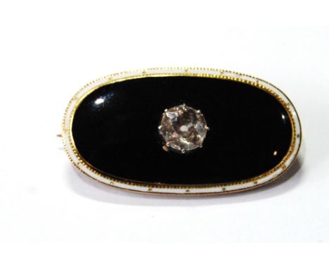 Gold oval brooch with old brilliant-cut diamond upon black enamel, with white border, dated 1904. Condition Report 31mm x 16m