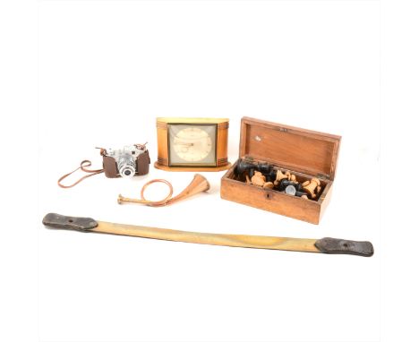 A Victorian walnut box containing a Stoughton pattern chess set, cribbage board, a pair of Bisley 7x50 binoculars, small bras