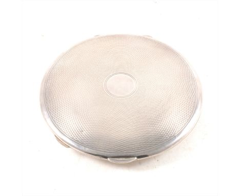 A circular silver engine turned compact by Walker &amp; Hall, Chester 1935, mirror to interior, 9cm diameter