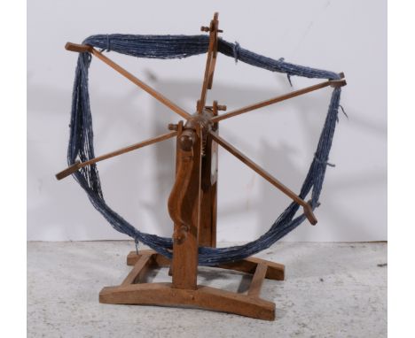 Vintage wooden wool-winder, on a trestle stand, 68cm overall.