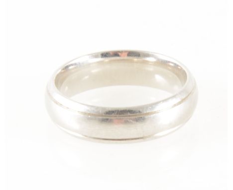 A platinum wedding band, 6mm wide plain polished d shape with lined border, hallmarked Birmingham, approximate weight 11.9gms