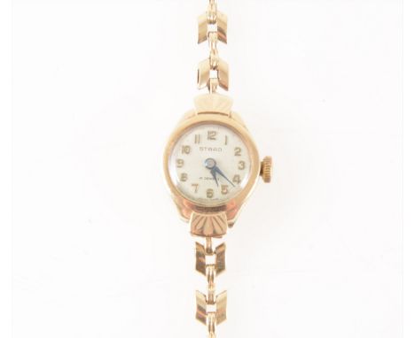 Strad - a lady's 9 carat yellow gold bracelet watch, circular cream arabic dial marked 17 jewels in a 9 carat yellow gold ton