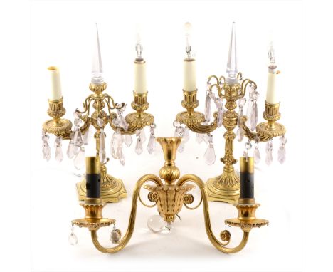 A pair of gilt metal two-branch candelabra with glass appliqués and pendants, 32cm; and a gilt metal two-branch wall bracket.