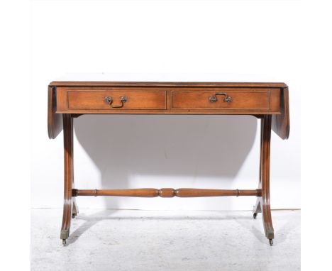 Reproduction mahogany sofa table, in the Regency style, rectangular top with rounded corners, two drop leaves, two frieze dra