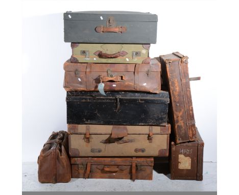 A vintage leather portmanteau and eight other vintage suitcases. (Qty: 9)