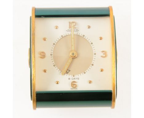 A Jaeger vintage travel alarm clock, square cream dial with quarter arabics and convex glass in a green and brass case, 6cm x