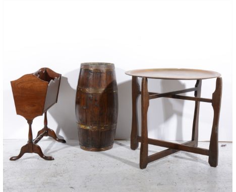 An Edwardian oak lazy susan, with a fruitwood inset, diameter 46cm; a coopered barrel shape stick stand, brass top folding ta
