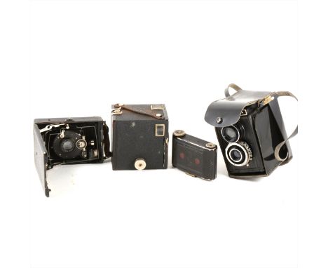 An Edwardian quarter plate folding camera together with a Zeiss folding camera and three post war cameras.