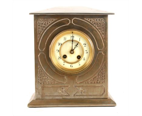 A steel plated mantel clock, brass decoration to the front fascia, with an earlier French movement, ivorine chapter ring, str