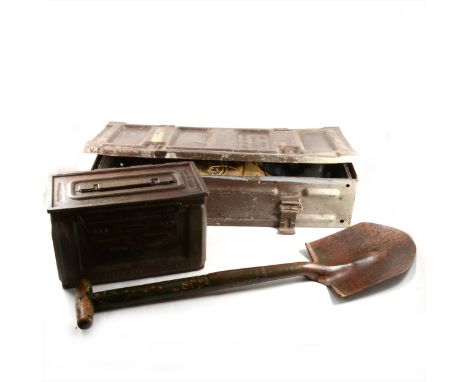 A German bayonet, two ammunition boxes, an entrenching spade, respirators and an American sergeants medals in frame.