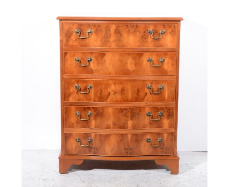 A reproduction yew wood finish bowfront chest of drawers, fitted with five graduating long drawers, bracket feet, width 76cm.