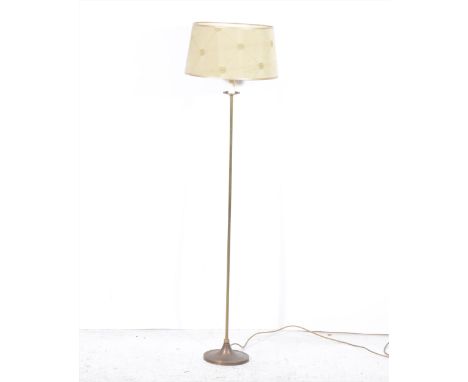 A small lacquered brass standard lamp, oval base, with shade, 137cm overall.