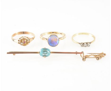 Three gemset rings and a bar brooch, a ring marked 18ct Plat set with three small diamonds, approximate weight 2gms, ring siz