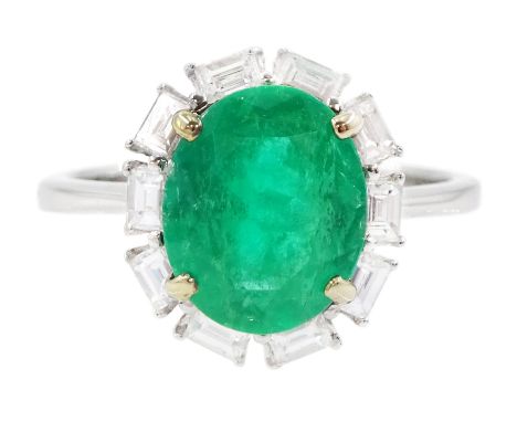 18ct white gold oval cut emerald and baguette cut diamond cluster ring, stamped 750, emerald approx 2.05 carat, total diamond