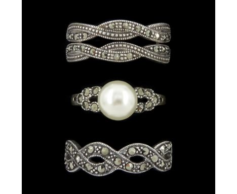 Silver pearl and marcasite ring and two silver marcasite crossover rings, stamped 925Condition Report:Pearl ring size M other