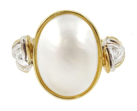 9ct gold three stone oval mabe pearl and round brilliant cut diamond ring, with Celtic design shoulders, London 1999Condition