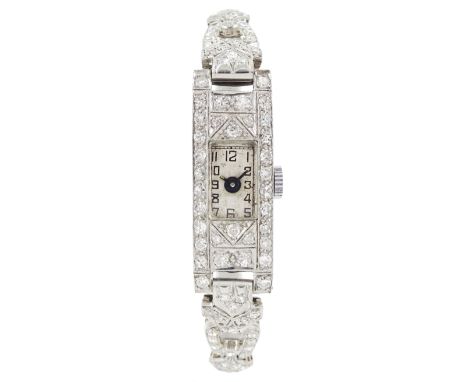 Art Deco ladies platinum diamond manual wind wristwatch, rectangular silvered dial with Arabic numerals, on a diamond link an
