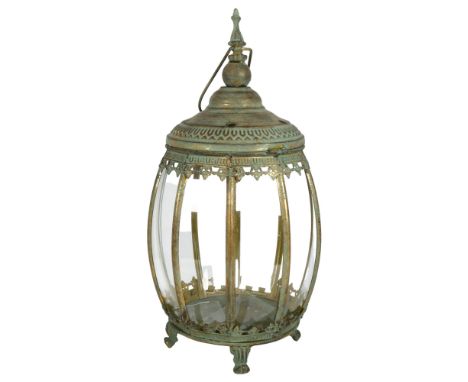 An Islamic pattern bulbous lantern on 4 feet, with fitted glass panels, H48cm 