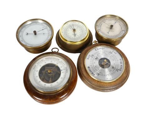 A quantity of Vintage brass and wooden barometers, largest diameter 18cm (5) 