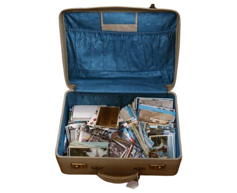 A suitcase containing various Vintage postcards 