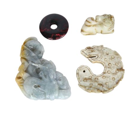 A group of 4 jade Chinese carved pendants, including a jade dragon, L9cm, a jade fish, a jade seated horse, and a jade disc (