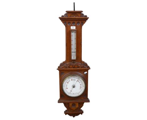 A carved oak-case aneroid wall barometer with thermometer, H99cm 