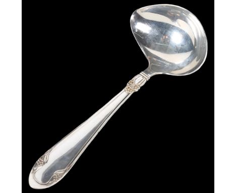 A Danish silver serving ladle of stylised form, with embossed decoration, impressed marks JS for Johannes Siggard, and Steenb