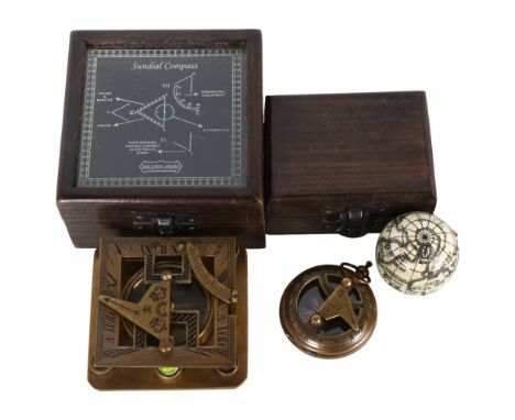 A boxed sextant, a boxed brass compass, and a fold-out globe with compass inside (3) 