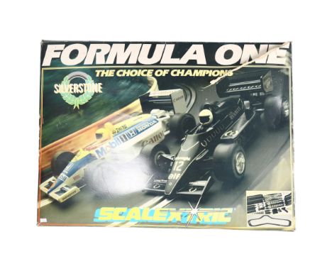 A Vintage 1990s Scalextric Formula One set, in original boxing, with associated literature, kit is in A/F condition, unclear 