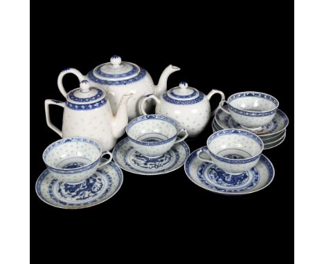 A Chinese blue and white rice grain tea setSet comprises of teapot, sugar and hot water, no milk, 4 cups and 7 various saucer