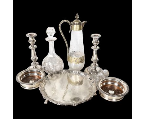 A group of silver plated ware, to include pair of silver plate on copper candlesticks, a cut-glass Claret jug with plated mou