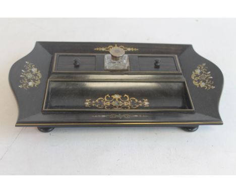AN ANTIQUE ROSEWOOD DESK STAND, with inlaid decoration, and a single white metal topped inkwell