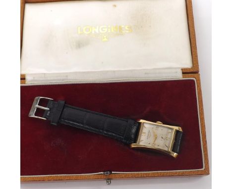 Fine Longines 14k hourglass curved gentleman's wristwatch, circa 1950, rectangular silvered dial with Roman numerals, baton a